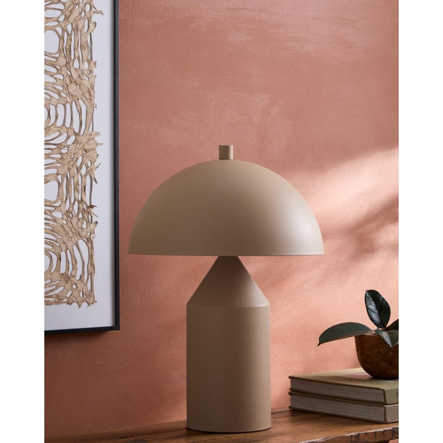 Illuminate your space with the Elder accent table lamp, a striking blend of industrial rustic charm that will captivate...