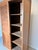 Elegant solid teak wardrobe featuring two sliding doors with distinctive louvered upper panels. The warm natural teak and...