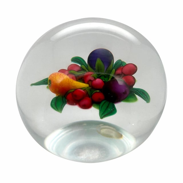 This is a lovely fruit and flower lampwork paperweight by the artist Ken Rosenthal. It has the signature R cane within the...