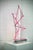 Mark Beattie, Pink Fracture, 2023 Powder coated copper & dimmable LED light on mirror polished stainless steel plinth 35 x...