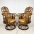 Mid century pair of rattan cane swivel chairs. Ornate woven wrapped frames with cane panels. Caning is woven in a...