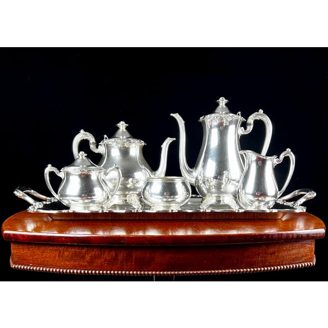 Elevate your sideboard or dining table with this monumental 6-piece silverplate master tea and coffee ensemble. This set...