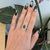 A 1.9-carat tsavorite garnet glows in a vivid grass-green at the centre of this solid two-tone 14K white and yellow gold...