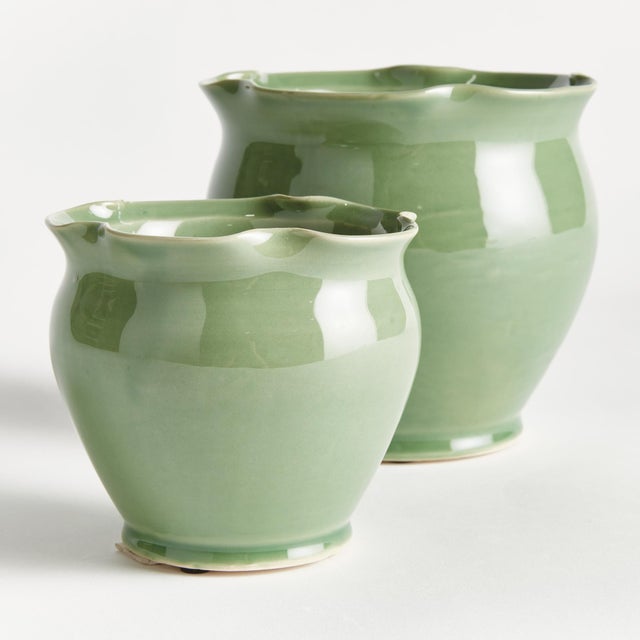 What makes these pots unique is the soft green glaze. The ruffle rim detail at the top adds a feminine touch. The perfect...