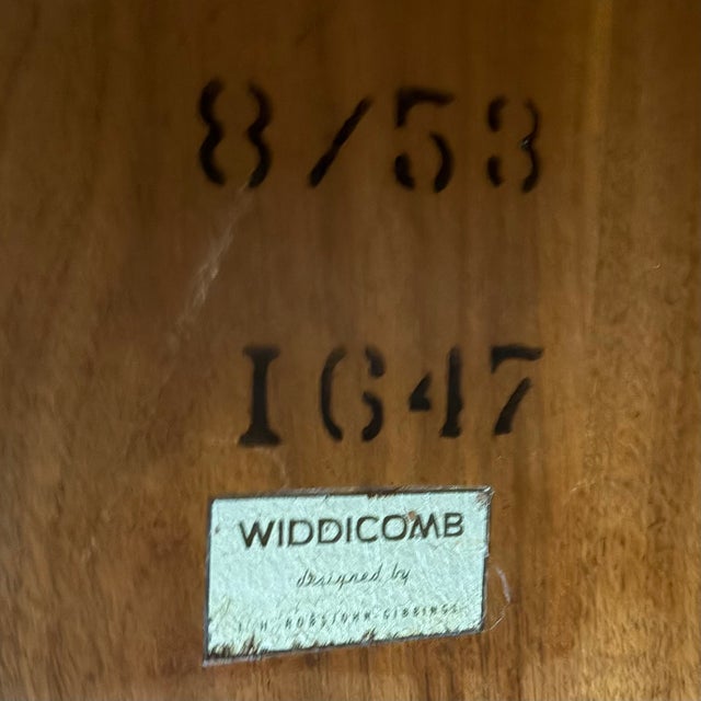 Robsjohn Gibbings; wonderfully iconic two tiered occasional table with tapered upright dowel legs. Elegant understated...