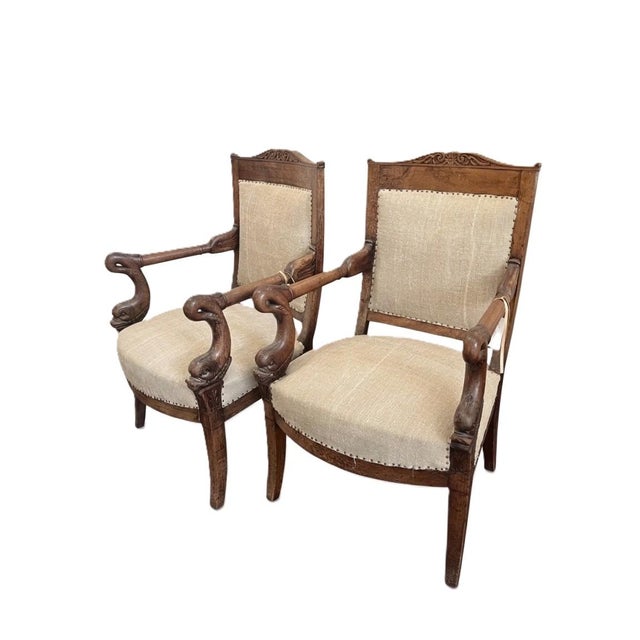 Pair of 19th Century French Empire Dolphin Armchairs. Nicely carved 23.25w x 23.5d x 36.75h and a 17.25"sh SKU 6-775 EBA
