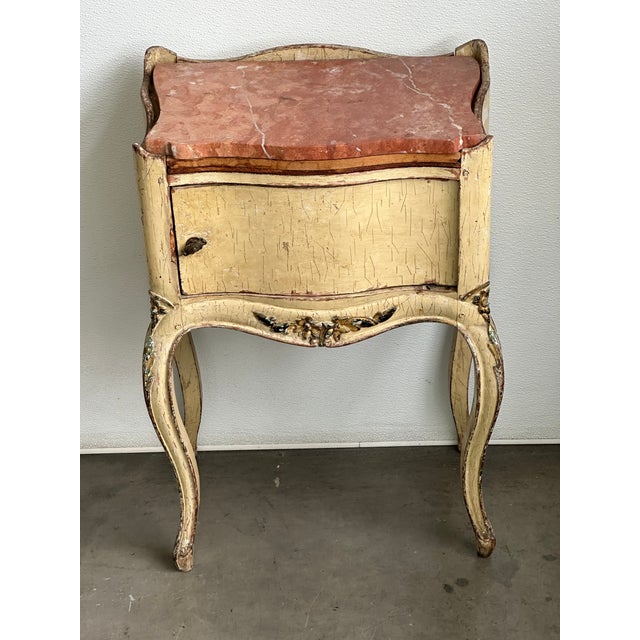 Antique French Louis XV–style chevet table with a distinctive pink marble top. Charming example of 19th-century Rococo...