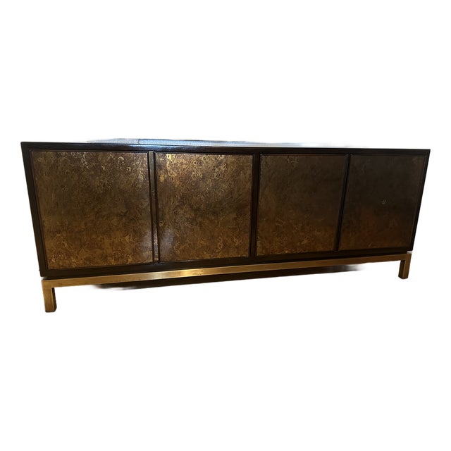 An exceptional four-door credenza featuring richly patinated, acid-washed bronze-tone panels, a sophisticated dark...