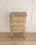 A charming French half chest of drawers dating to the nineteenth century, executed in the Transition style that bridges...