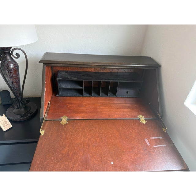 Vintage slant-front secretary desk in the Colonial Revival / Early American style, likely dating to the 1930s–1940s....
