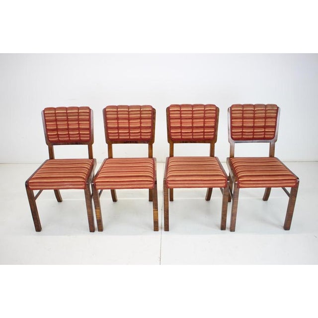 Set of four Art Deco dining chairs manufactured in Czechoslovakia in the 1930s. The frames are finished in beautiful...