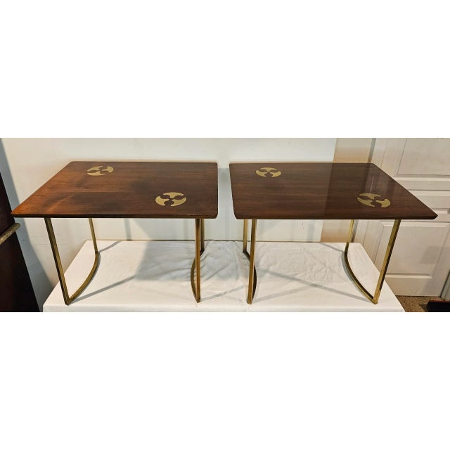 This Pair of Mid-Century Modern Walnut W/Organic Inlaid Brass Side Tables By Mastercraft combines mid-century charm with...