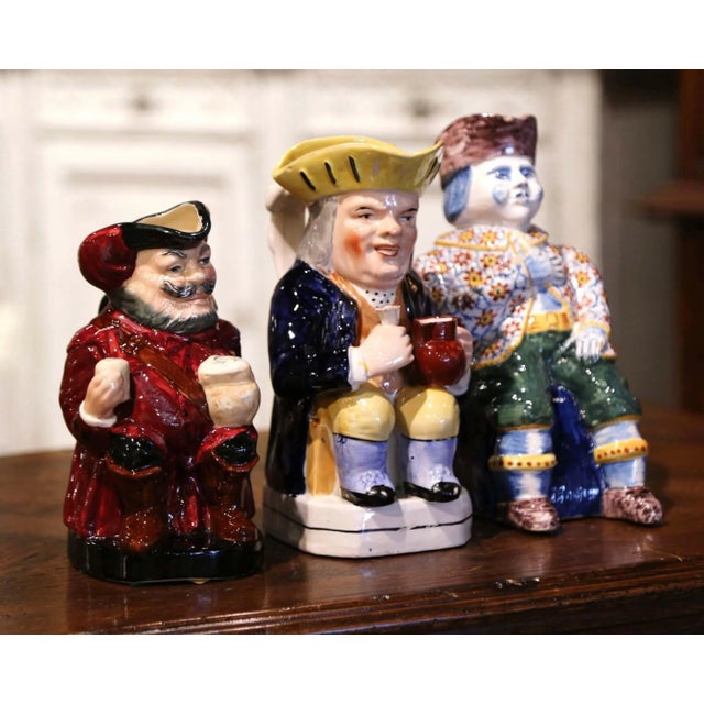Decorate a wet bar with this charming, sculptural set of antique majolica pitchers. Crafted in England circa 1890, each...