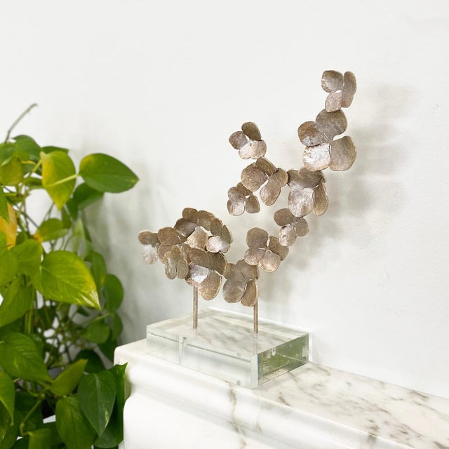 Add a touch of luxurious whimsy to your space with this exquisite accessory. With handmade, individually bent flowers...