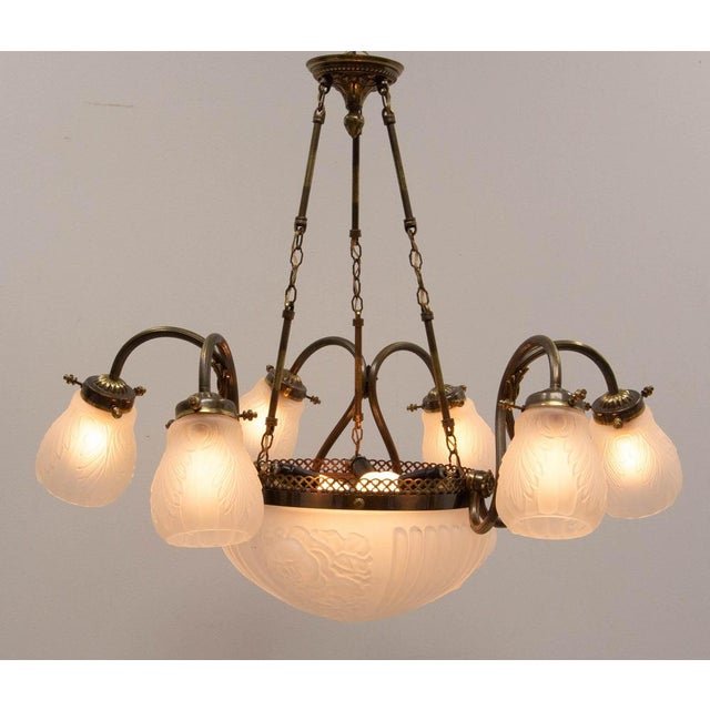 Frozen glass and brass chandelier or lustre, french luminaire made circa 1930 in the art déco period around a large dome...