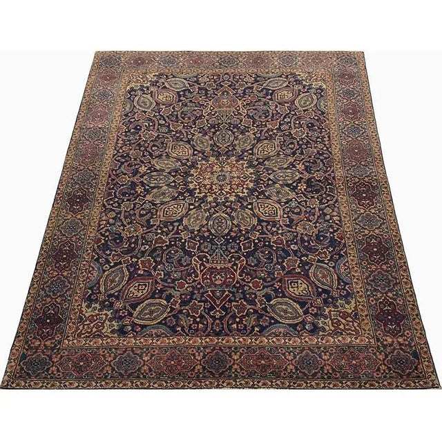 ACTUAL SIZE: 4’6″ x 6’2″ PRIMARY COLOR: Navy / Burgundy AGE: Old MATERIALS: Wool FOUNDATION: Cotton PRODUCTION: Handwoven,...