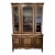 Vintage French Provençal 2 Piece China Display Cabinet With Checkered Veneer, Brass Pulls, Carved Details, 3 Top Shelves, and Bottom Storage For Sale