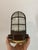 Restored vintage industrial caged bulkhead light, dating approximately from the 1970s. The lamp features a robust metal...