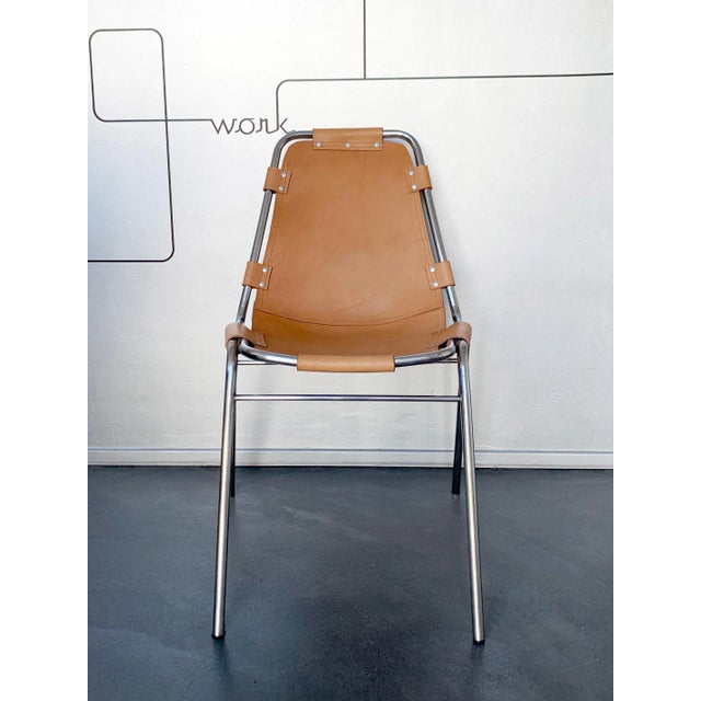 Dining chair commissioned by Charlotte Perriand for the 'Les Arcs' Ski Resort. New leather seat, following the original...