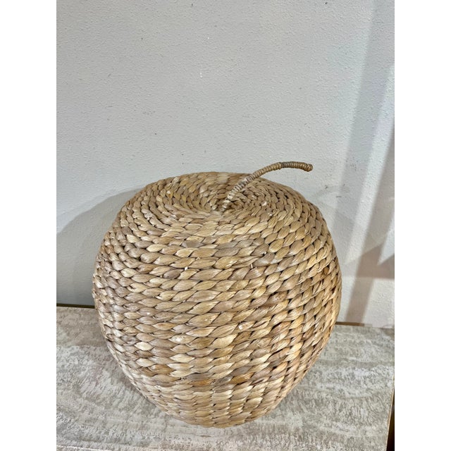 Such a fun piece! Large size sea grass apple. Sea grass wrapped around an interior metal frame. Purchased in Paris.