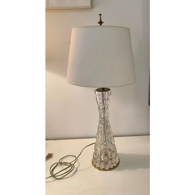 Exceptional hourglass form crystal lamp with brass fittings. The lamps were made in Sweden at Orrefors glasbruk. This is...