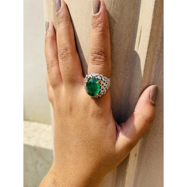 Dome Emerald And Diamond Cocktail Ring in 18K Gold featuring natural emerald of 9.48 carats and diamonds of 2.03 carats....