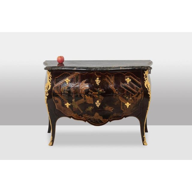 Lacquer saute chest of drawers opening with two drawers on the front with its scalloped marble top in black color. Work...