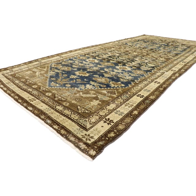 Vintage Persian Malayer Gallery Rug 05'00 x 11'04. Warm and inviting, this hand-knotted wool distressed vintage Persian...