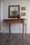 Built from solid pine, this table carries the kind of surface you only get from time — wide boards, softened edges, and a...