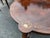 This antique English Rosewood center table features a string inlay with flowers, adding a touch of elegance to any room....
