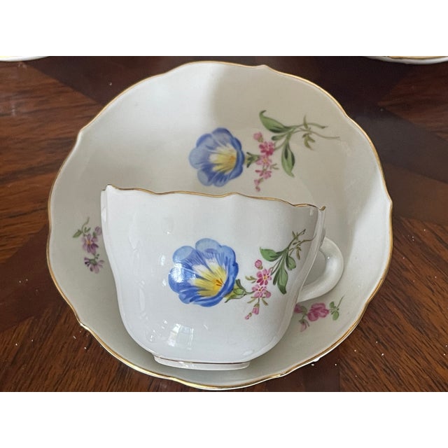 Vintage Meissen porcelain with crossed swords blue sign 3 sets of demitasse cups and saucers with handpainted florals.