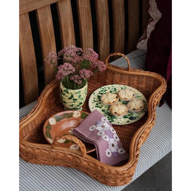 Our Tulpina napkins are made from hand-loomed linen and embroidered by artisans, featuring a floral design inspired by...