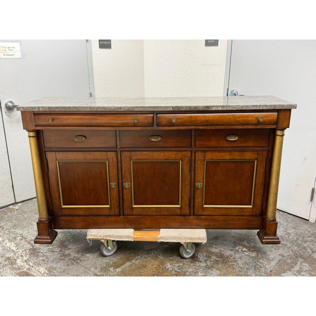 Design Plus Gallery presents the American Empire Style Buffet from Bassett, a distinguished case piece with a polished...