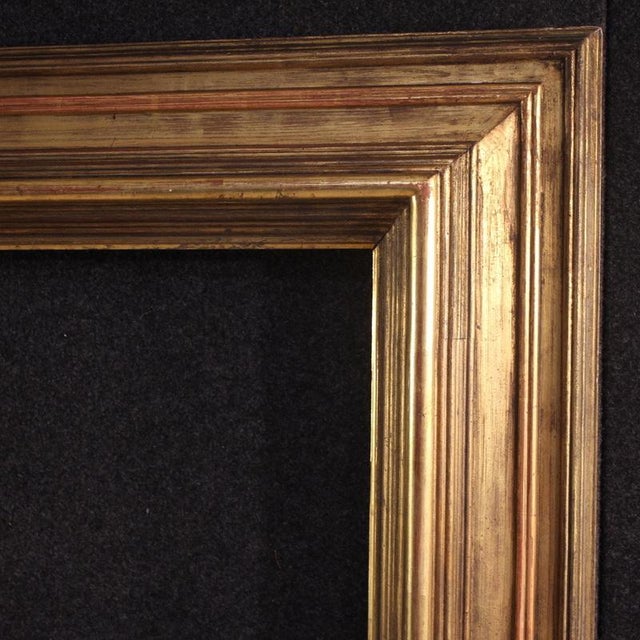 Great mid-20th-century Italian frame. A high-quality, exceptionally large carved and gilded wooden piece. It can...