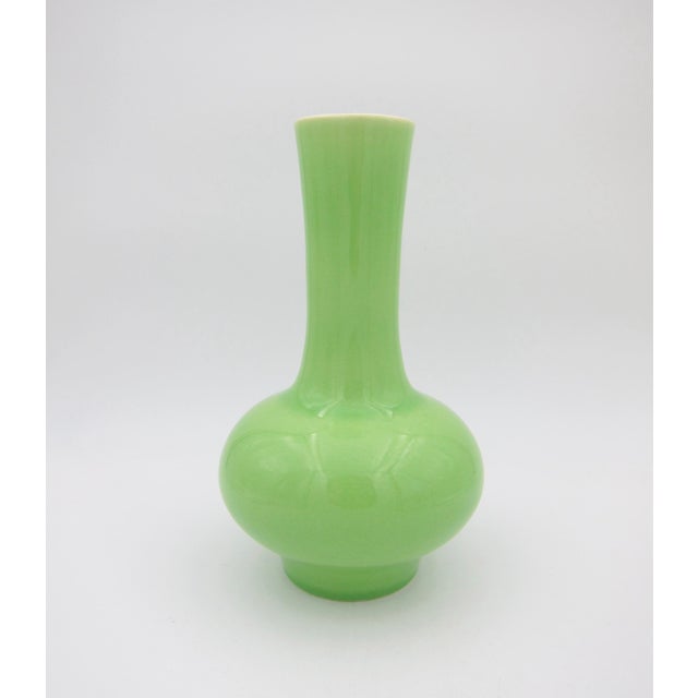 An American porcelain vase by mid-20th century ceramicist Rodney Rouse (1903-1977) of Trenton, New Jersey, dating circa...