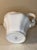 A beautifully sculpted, glossy white ceramic pitcher that perfectly captures a timeless, vintage-inspired look. Featuring...