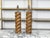 A vintage pair of French wooden table lamps from the mid 20th century, with twisted Solomonic column style motifs and...