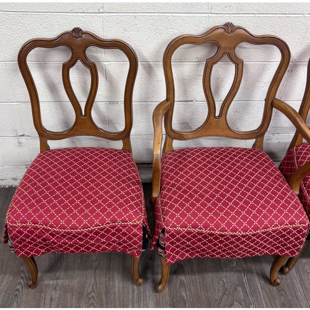 This is a gorgeous vintage set of four French Provincial or French Louis XV style dining chairs featuring sculptural open...