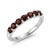 This elegant band ring features a row of rich Garnet gemstones, admired for their deep red hue and captivating brilliance....