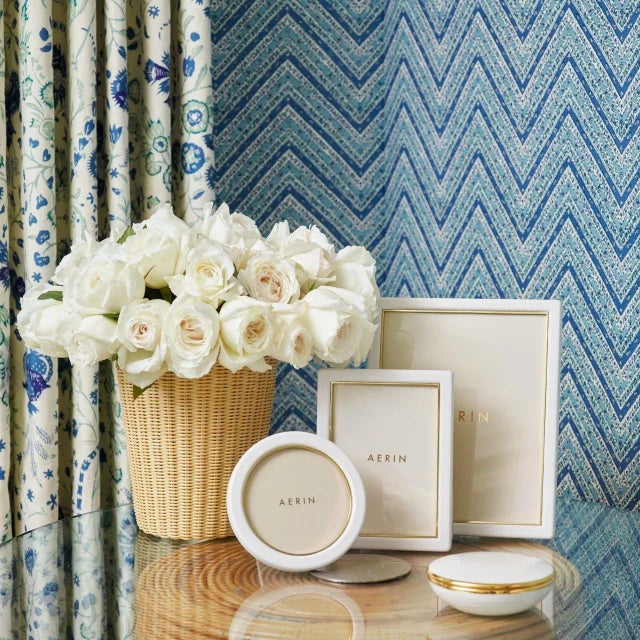 This contemporary frame combines the luxury and texture of Italian leather with the warmth of gold detailing. Perfect for...