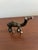 Charming vintage brass camel figurine featuring a clean minimalist form and warm aged patina. This petite decorative...