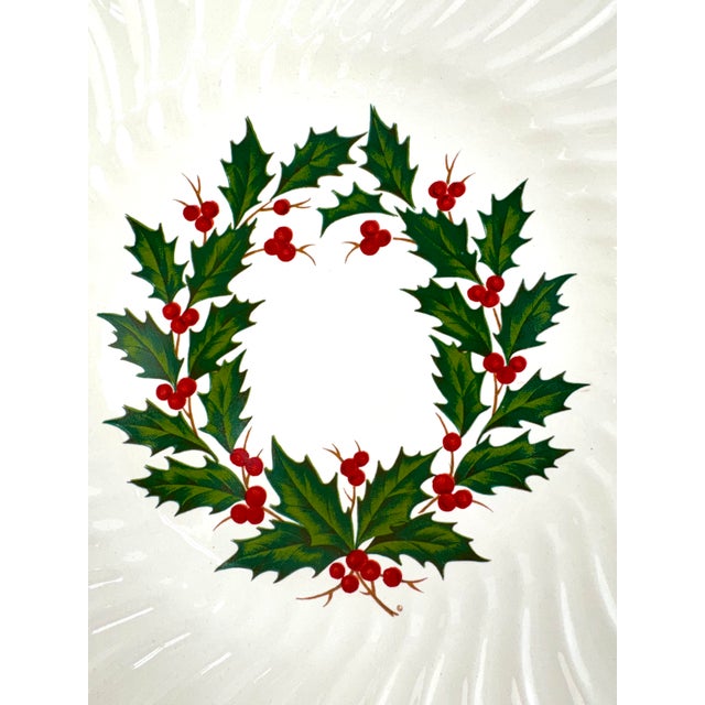 A festive set of twelve vintage SCIO dinner plates featuring the classic Holly pattern. Each creamy white plate is...