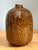 A striking example of mid-century ceramic artistry, this vintage handcrafted vase celebrates the era's fascination with...