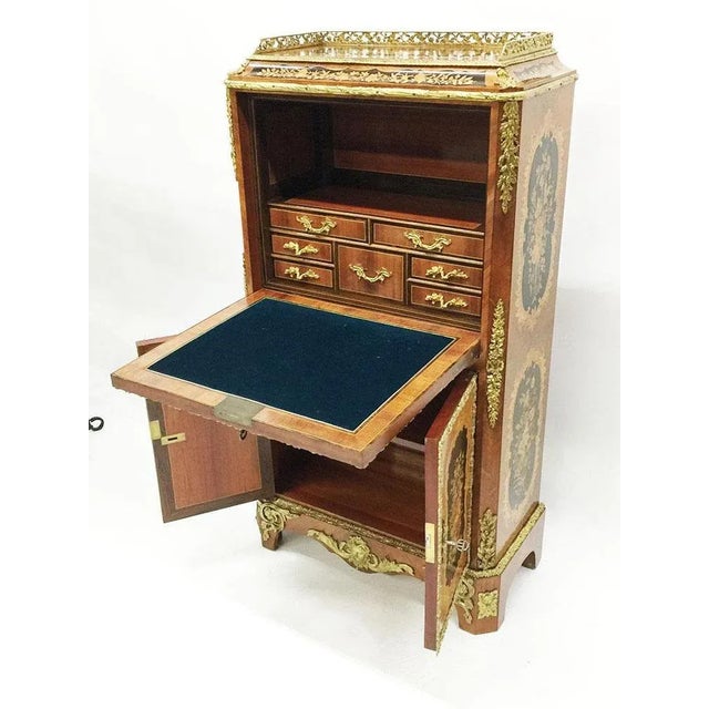 A 19th century marquetry children's bureau secretary a marquetry children's bureau secretary. A miniature secretaire...