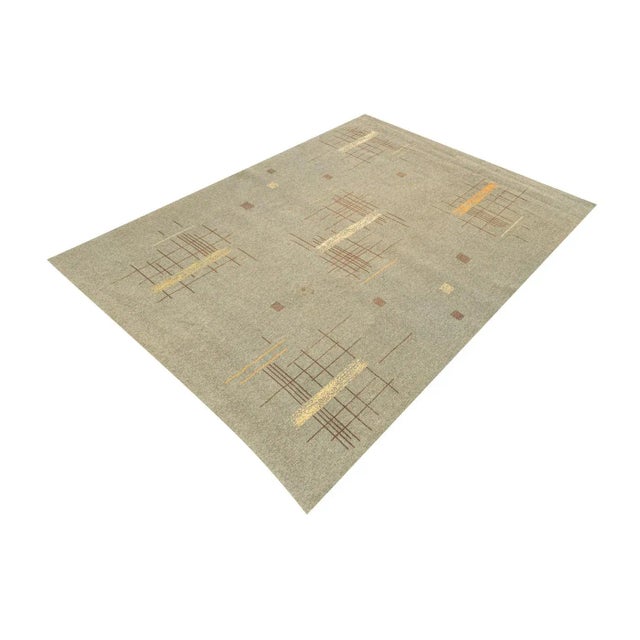Rug from the 1950s with a time-typical pattern in gray, beige, cream white and saffron tones. Characteristics: - High...