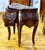 This elegant French-style two-drawer cabinet features a richly finished wood construction with a graceful bombe silhouette...