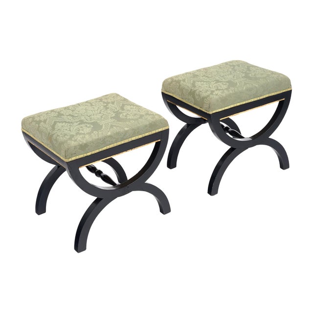 Pair of stools made of solid wood construction from France. Each is ebonized and finished with a lustrous French polish....