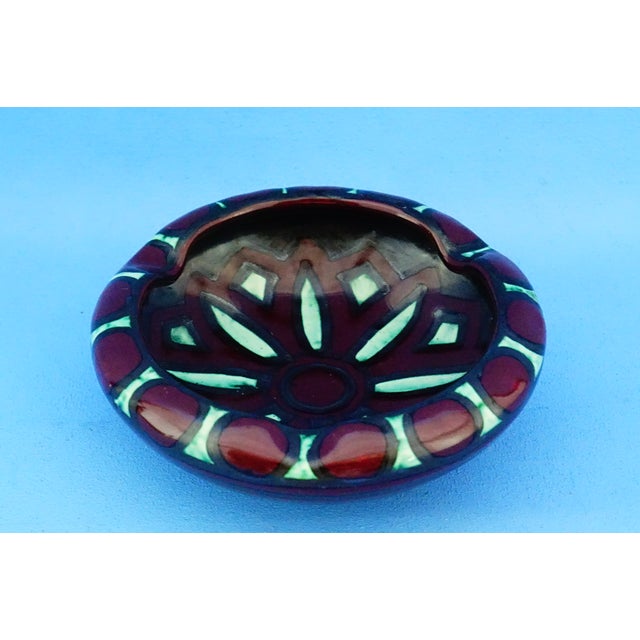 Measurements: diameter: 15 cm; height: 5 cm; weight: 0.405 kg item : an exquisite majolica ashtray, 15 cm in diameter and...