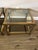 Pair of heavy side tables in mastercraft style excellent condition heavy smoked glass on bottom and clear beveled glass top