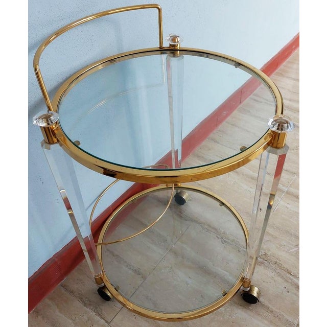 Vintage corner table or trolley, round glass and methacrylate drinks trolley or serving cart. Circa 1970. It's round and...